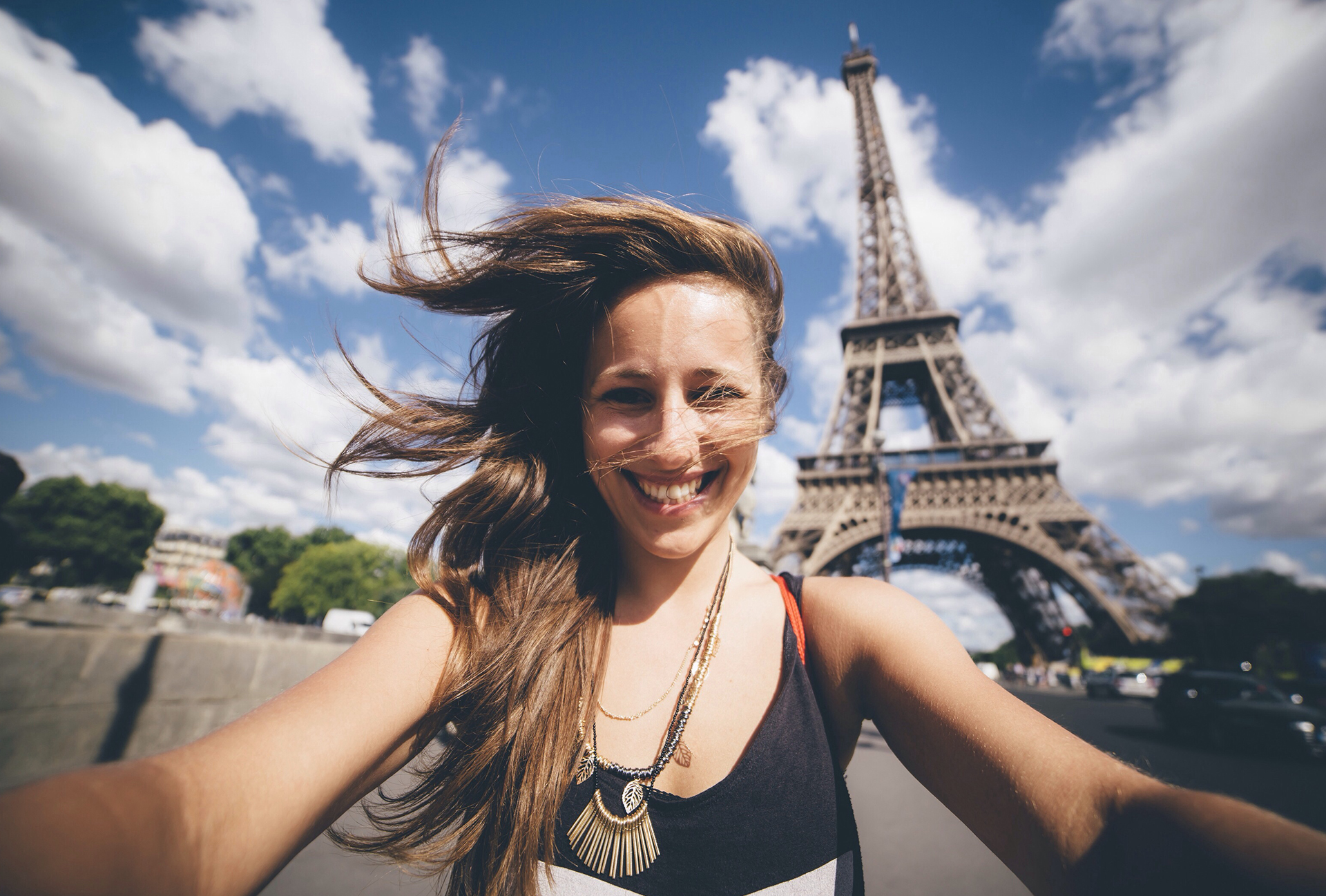 woman in front of the Eiffel tower in Paris